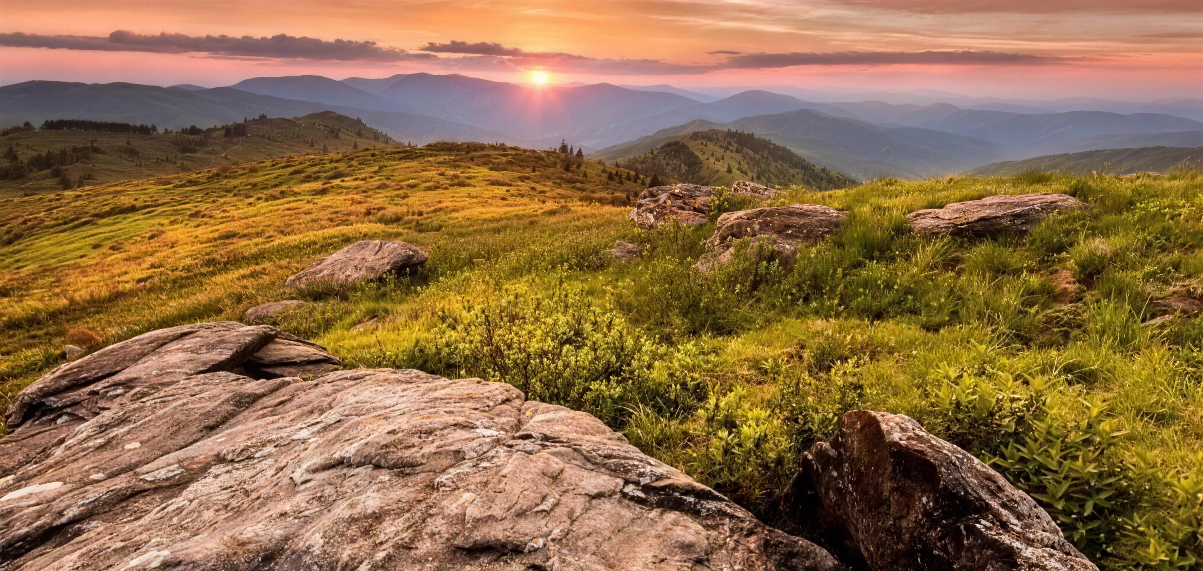 The treeless grassy summit of Black Balsam Knob with panoramic mountain ridgelines in every direction